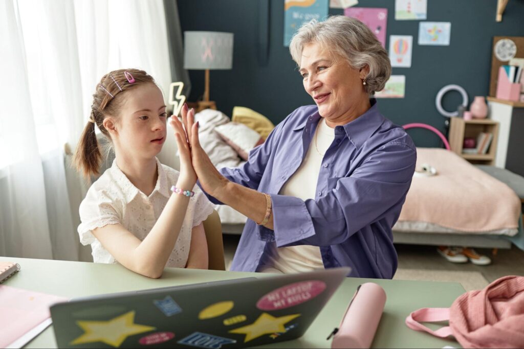 Grandmother and granddaughter share a joyful moment, fostering connection and love.