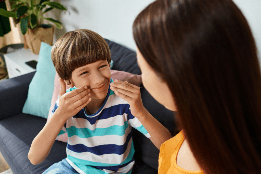 Parent and child share joyful moments filled with laughter and connection at home.