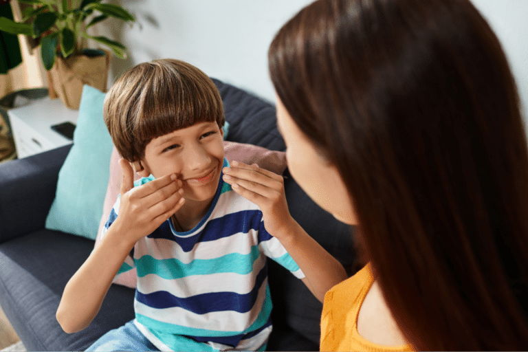 Parent and child share joyful moments filled with laughter and connection at home.
