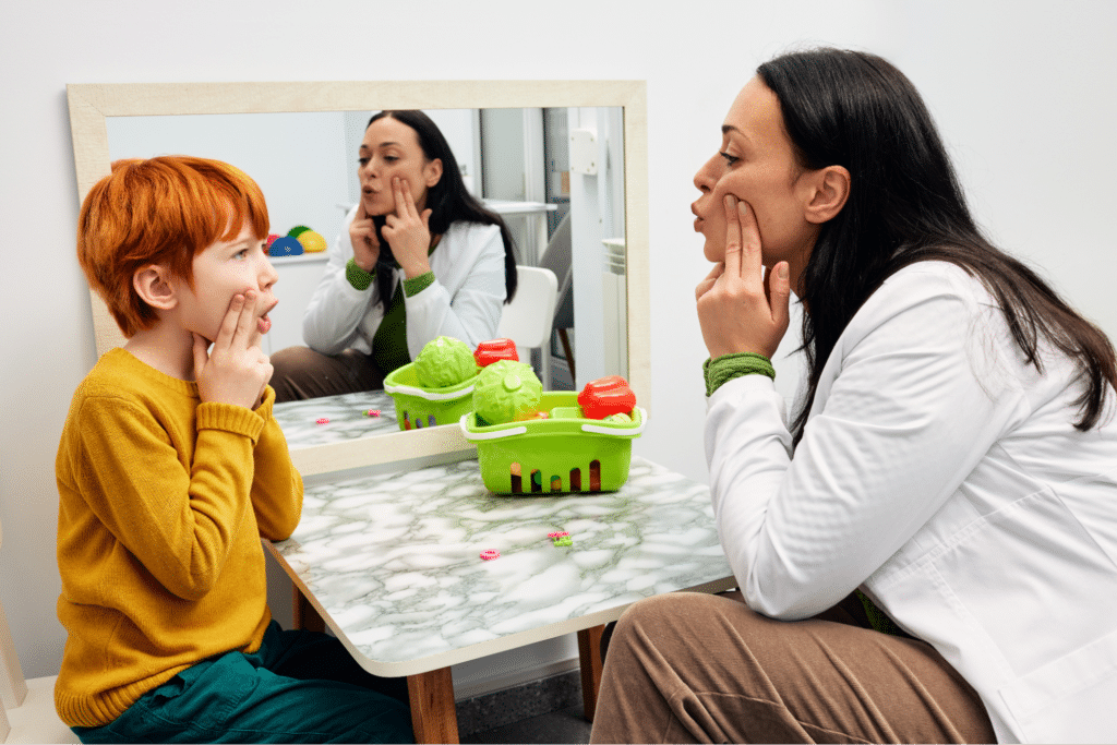 Child with phonological disorder interacting with speech therapist