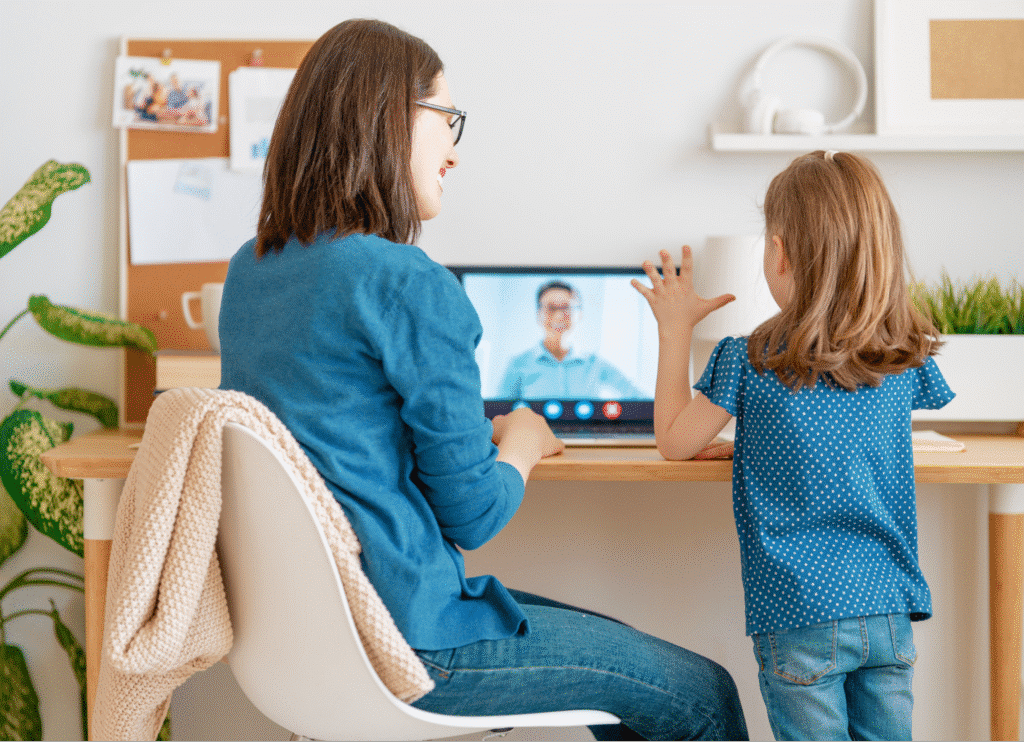 Mom and daughter enjoying a video call together at home.