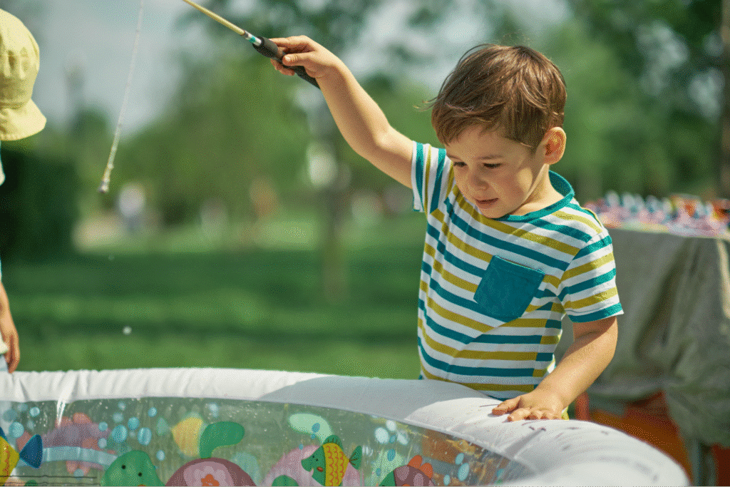 Child playing joyfully with bubbles in a sunny summer setting.