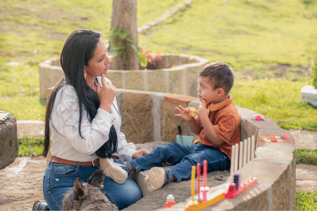 Mother and child enjoying playful moments outdoors, sharing laughter and creativity together.