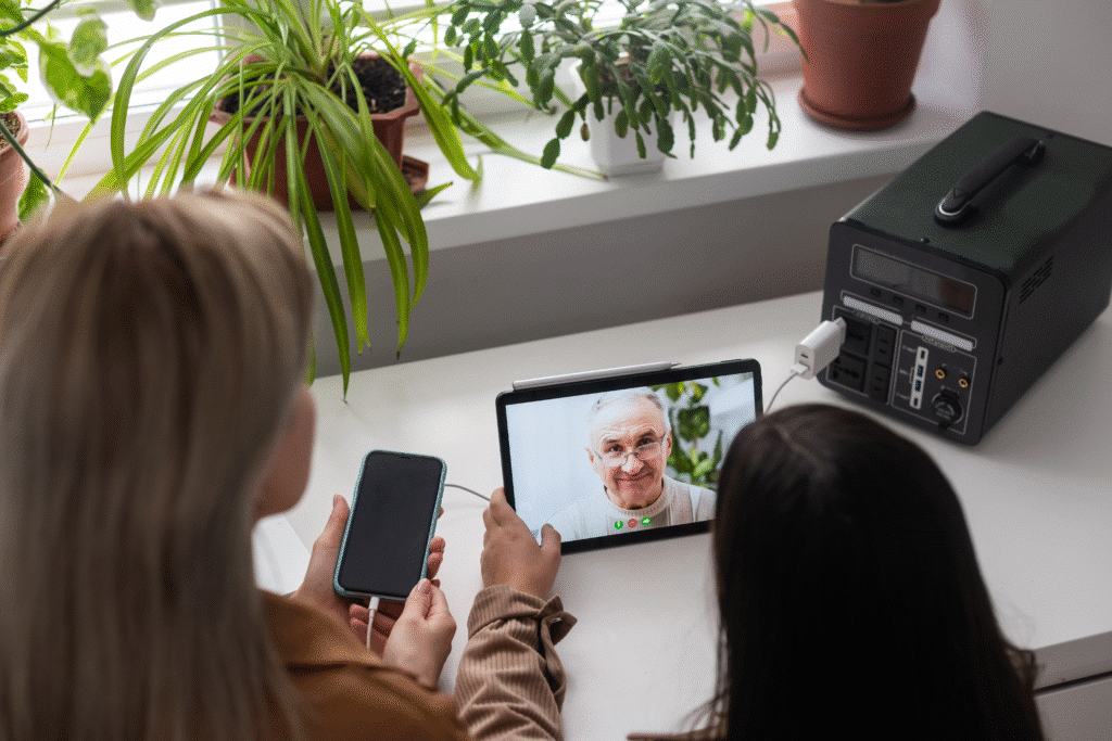 Video call connecting family members with a grandparent, showcasing love and technology.