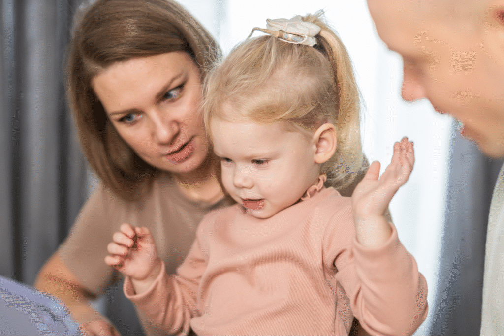Family bonding time with a child exploring through screen interaction.