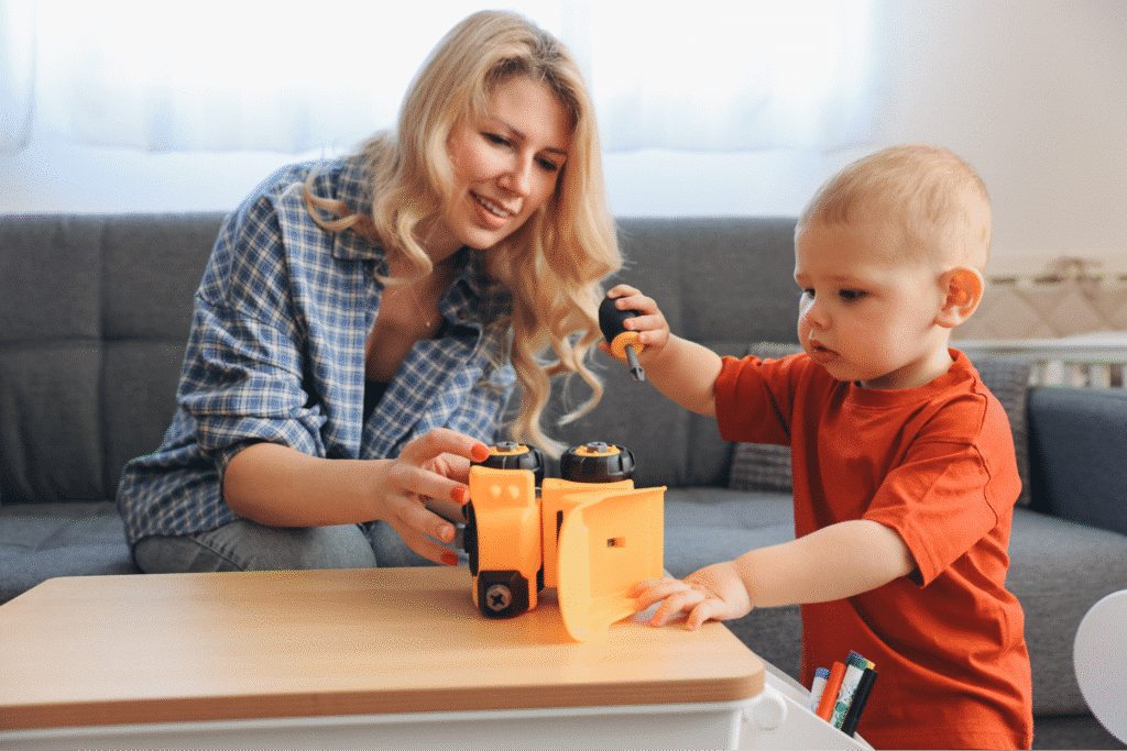 Mother and child play together with toys, fostering creativity and bonding time.