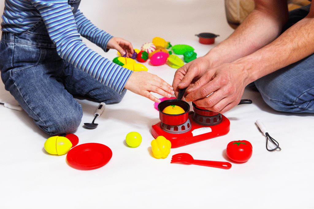 Children play with colorful toy kitchen set, enhancing creativity and imaginative play.