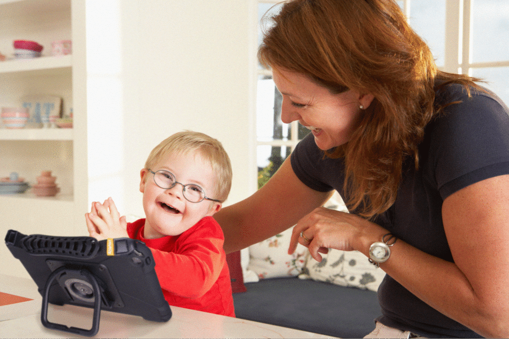 Woman and child enjoying quality time while using a tablet together.