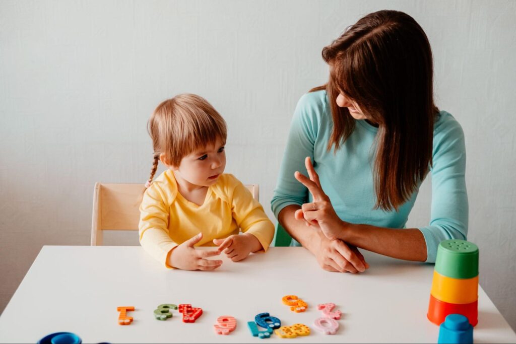speech therapist narrating play with toddler