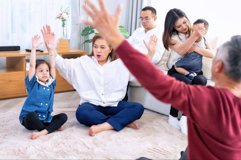 Family joyfully participating in a fun activity together at home.