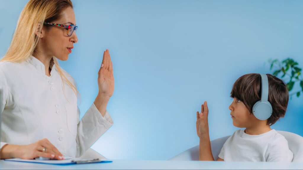 AAC adaptations for deaf and hard of hearing concept with child taking a hearing test
