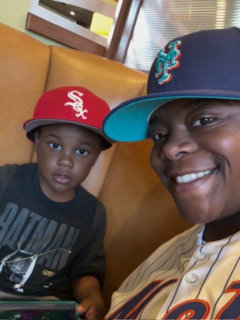Happy mother and son sharing a joyful moment together in a casual setting.