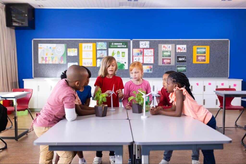 Kids experimenting with plants in a vibrant classroom science project.