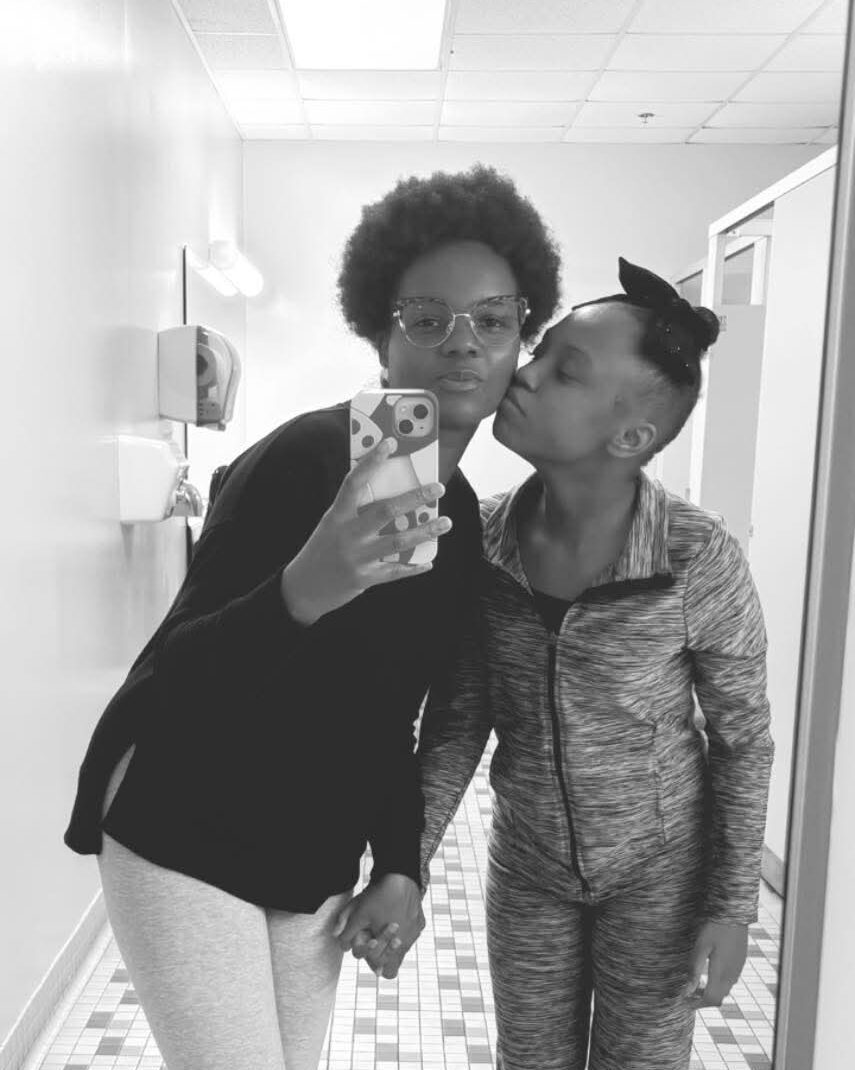 Mom taking selfie with her kid.
