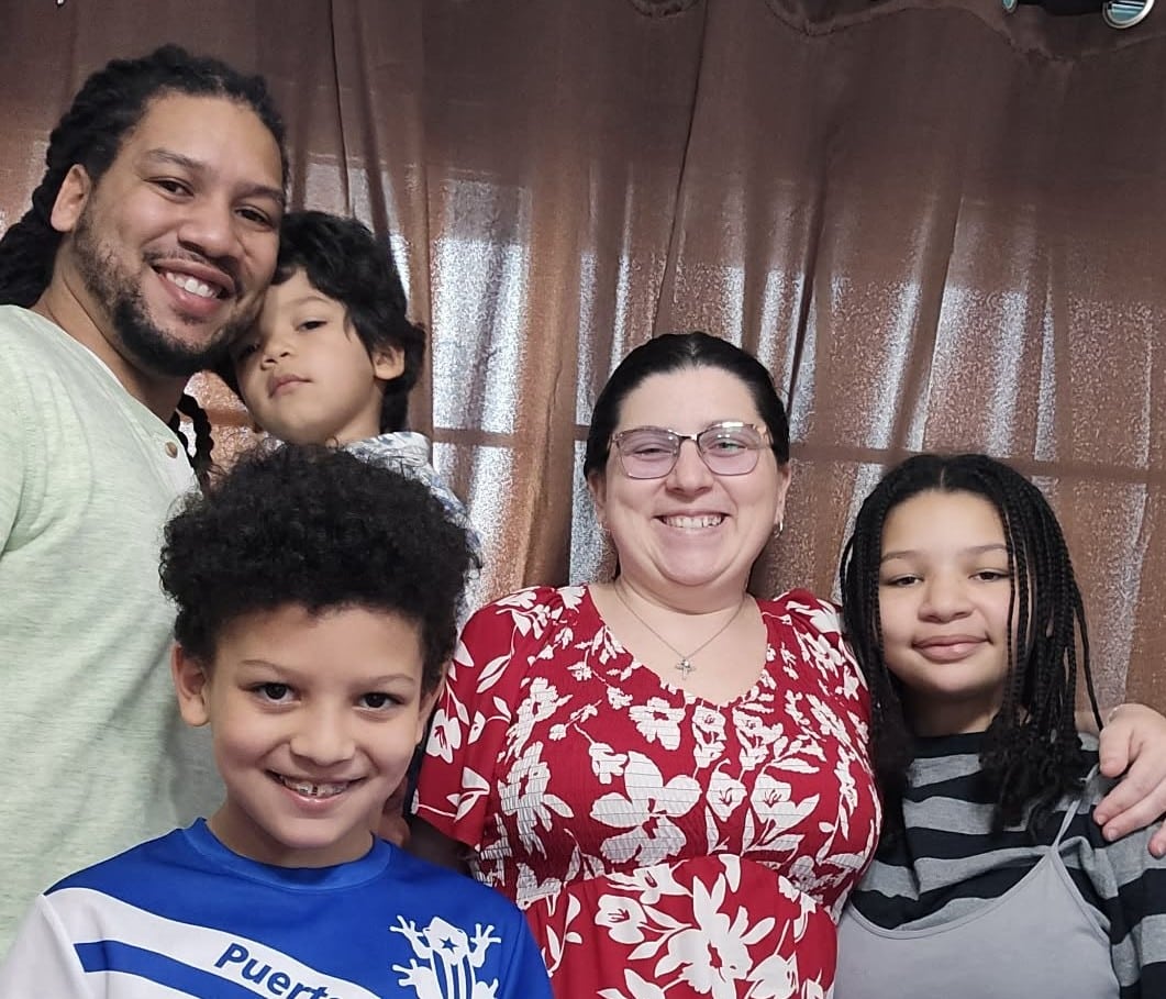Happy family portrait with children smiling together in a warm and loving atmosphere.