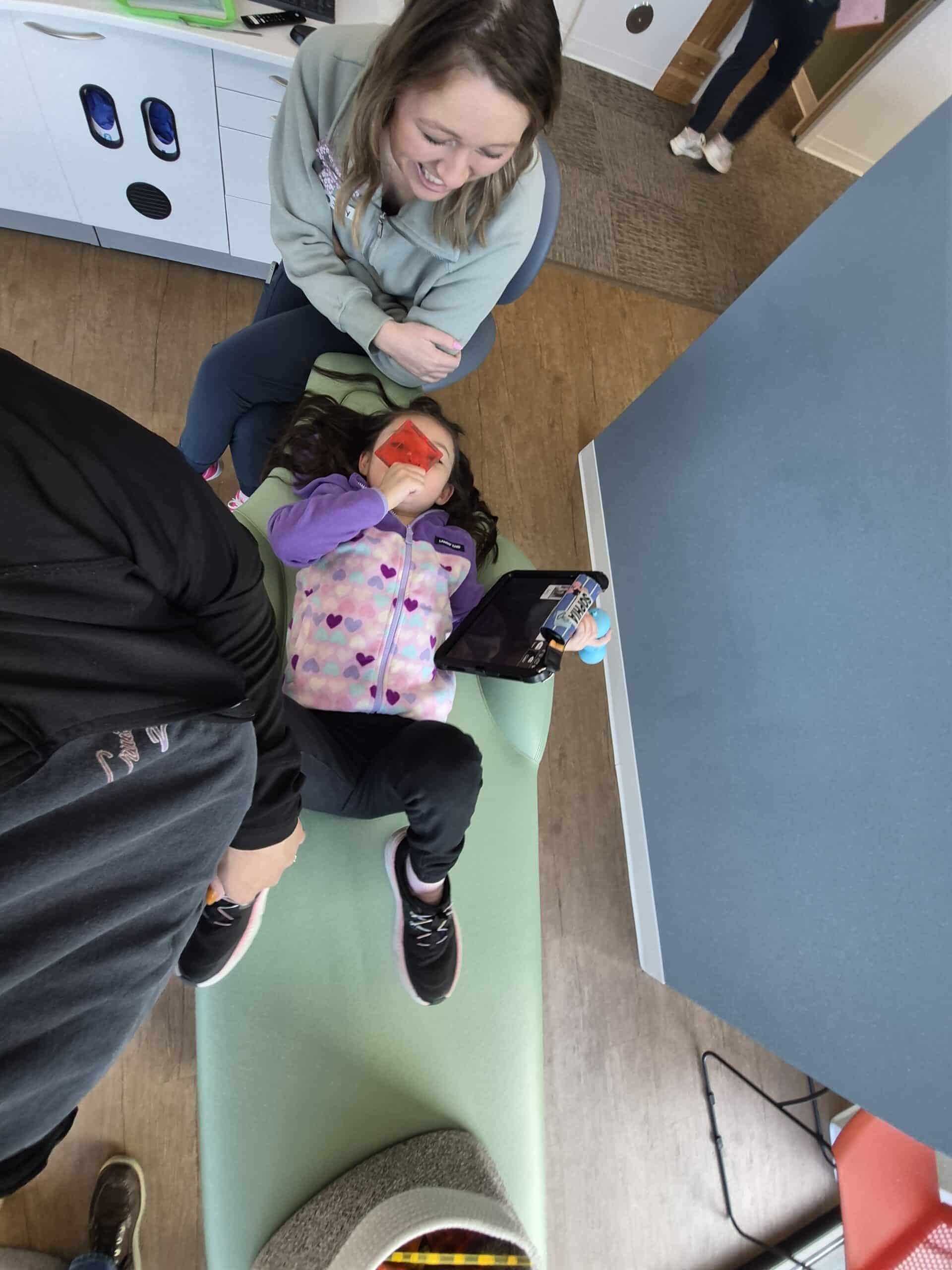 A joyful child plays with mom, embracing happy moments together at Able Families.