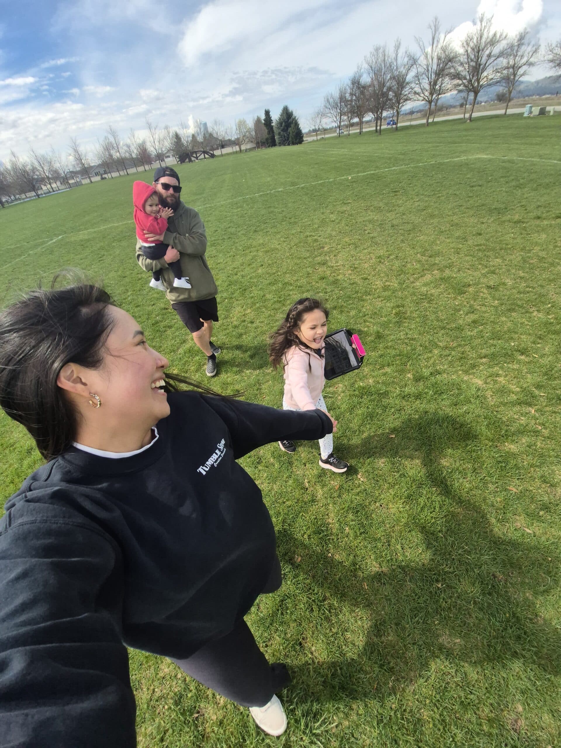 Happy able families enjoying a fun day at the park together.