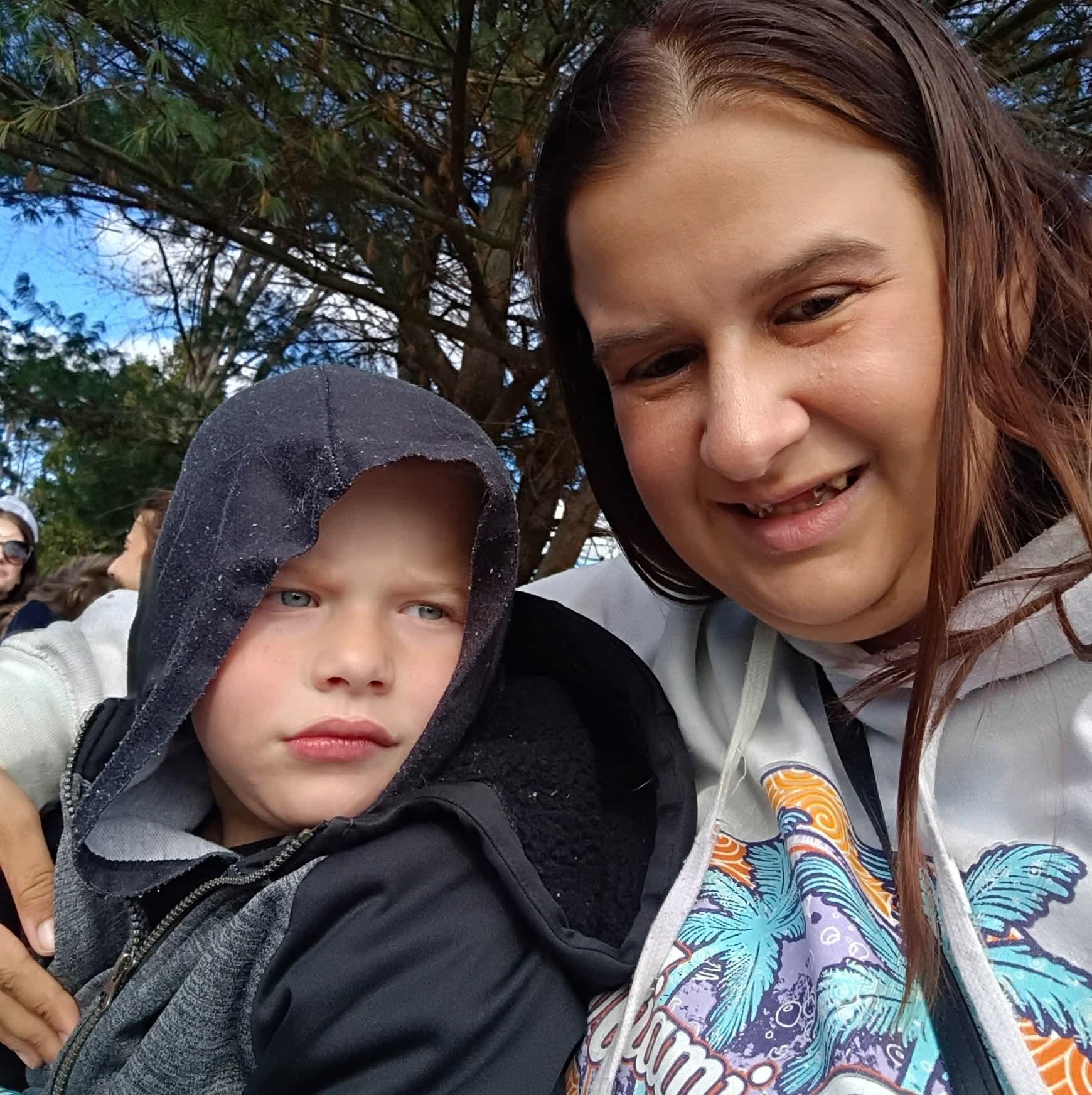 A mother and son sharing a special moment in the park, celebrating ablefamilies.