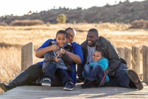 Happy ablefamilies enjoying quality time together outdoors in a natural setting.