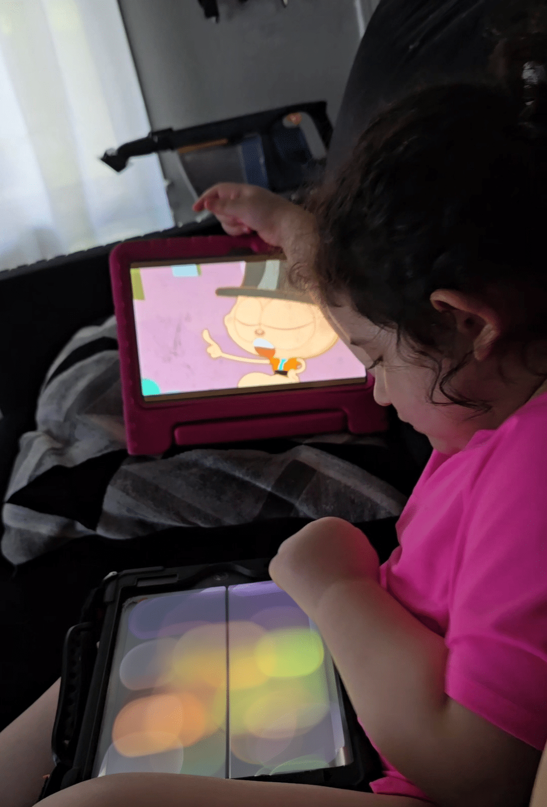 Sophie using her QuickTalker Freestyle speech device