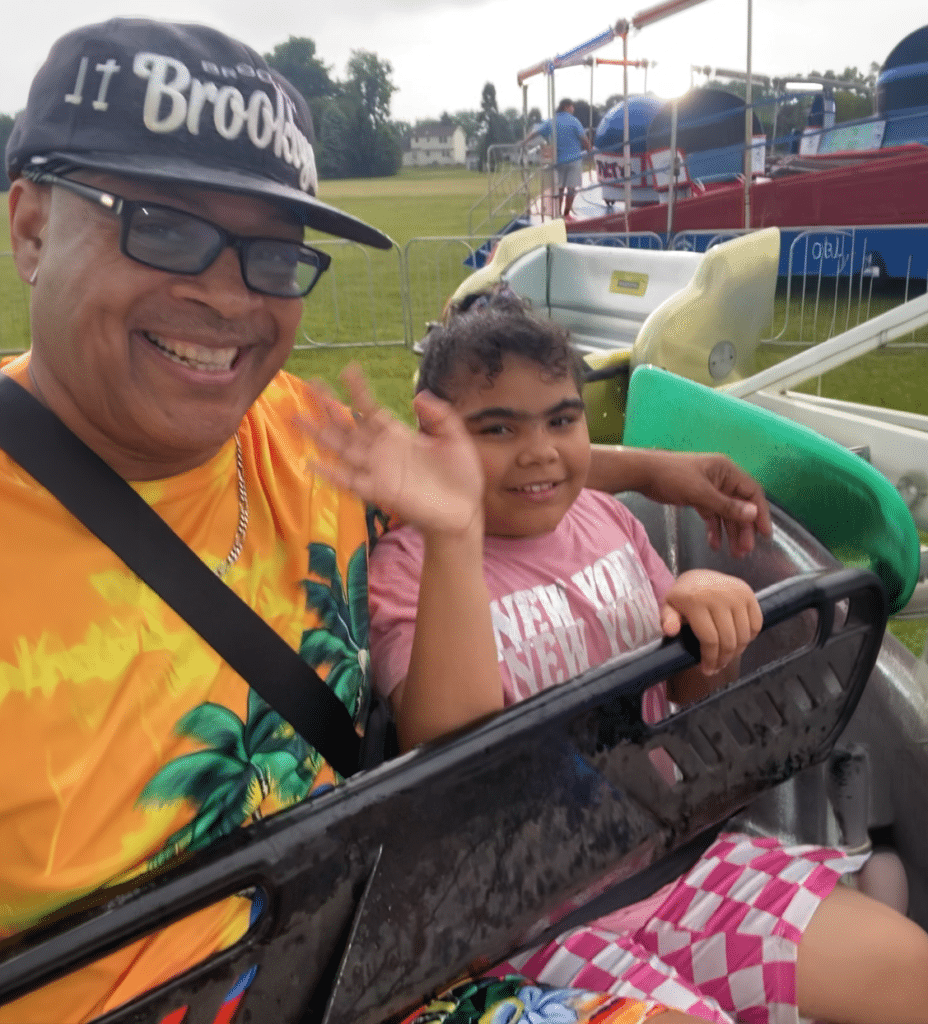 Happy kids enjoy a fun fair ride together, celebrating joyful family moments.