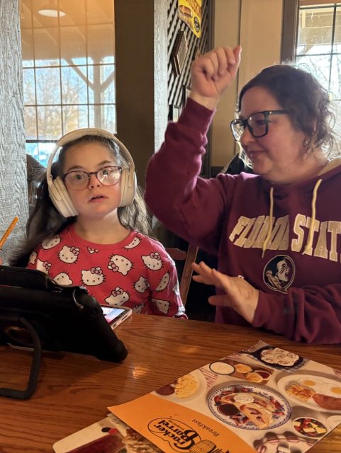 Kids enjoying a lively meal at a family-friendly restaurant, sharing fun moments together.