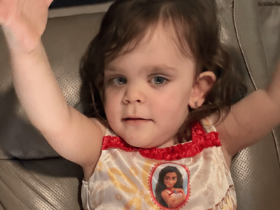 Child enjoying interactive play on a tablet, engaging with AbleFamilies content.