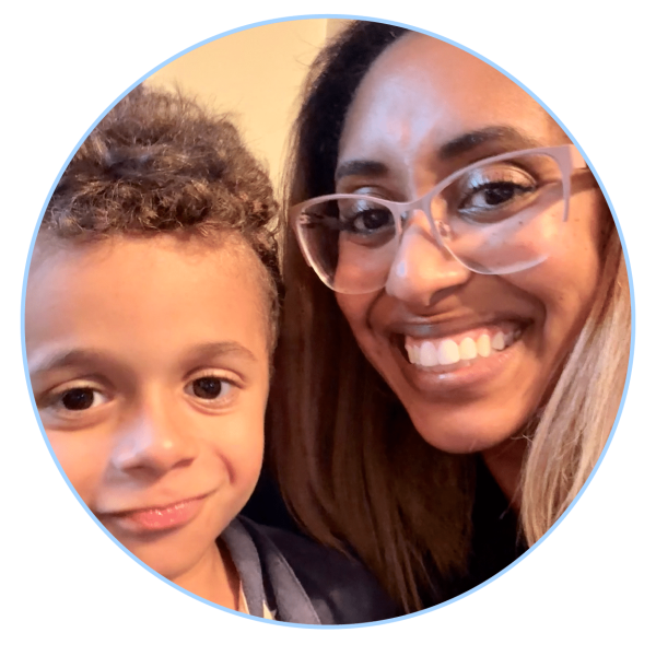 Happy mother and son smiling together in a cozy, warm setting.